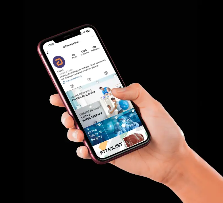 A person holding a smartphone displaying the Instagram profile of Ashva Weartech, showing posts related to physiotherapy, AI in surgery, and fitness technology.